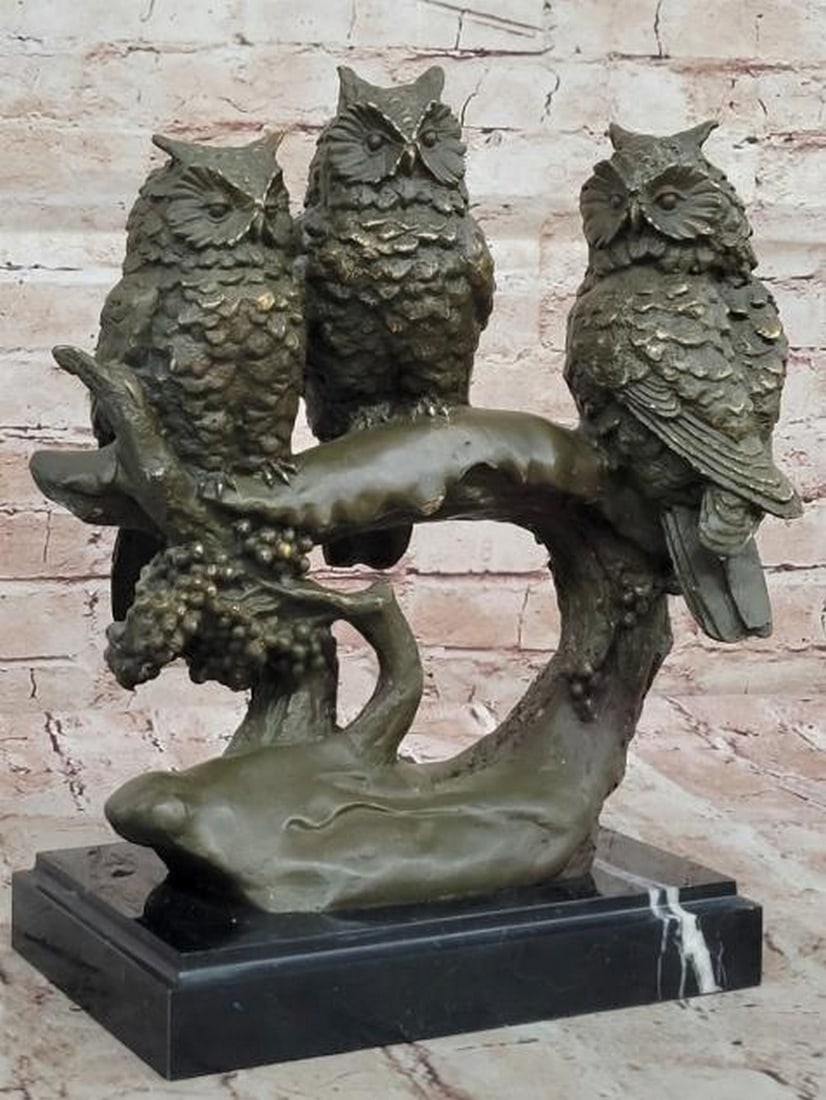 Wisdom in Threes: Bronze Owl Trio on Branch: Wisdom in Threes: Bronze Owl Trio on Branch This captivating bronze sculpture features three owls perched closely together on a textured branch, each with its own distinct pose and expression. Symboli