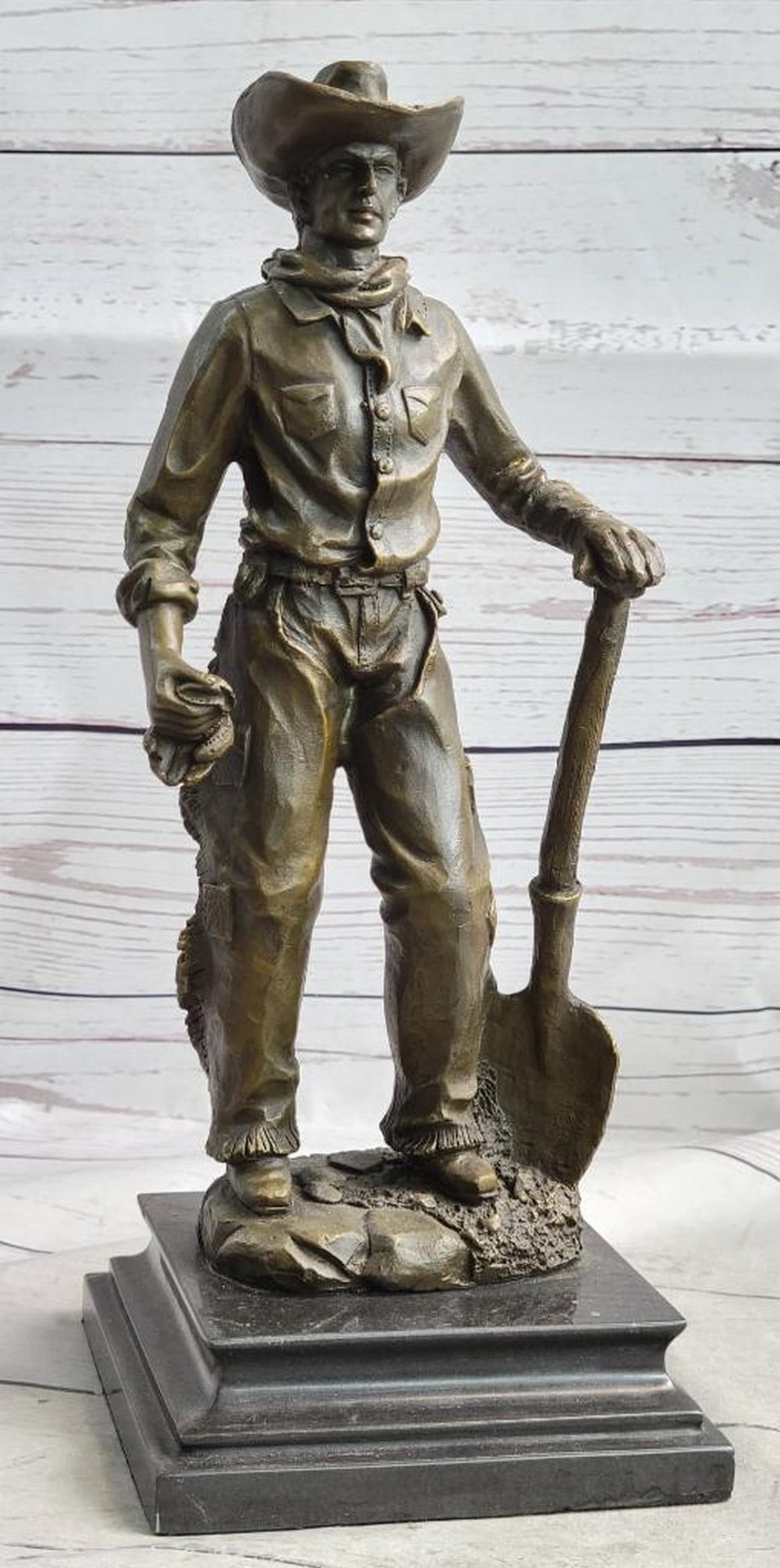 Cowboy in Chaps Holding Shovel Bronze Statue Sculpture Figure Country Western 12" x 5": This Is A Sculpture Of A Classic Cowboy. He Wears His Cowboy Hat And His Handkerchief Loosely Tied Around His Neck And Holding A Shovel In His Hand. On His Feet Her Wears Boots Which His Jeans Cover I