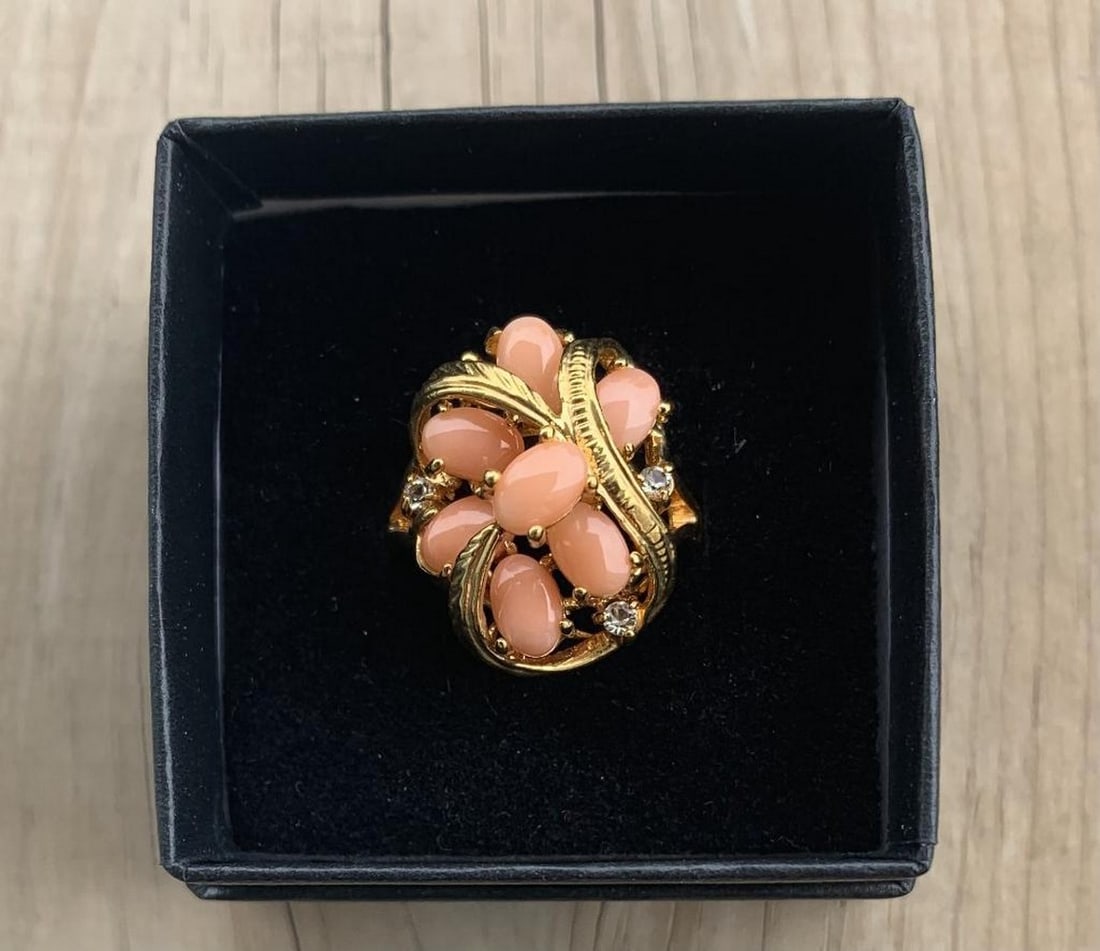 Stunning Coral Gemstone Ring: Stunning Coral Gemstone Ring Vibrant and full of charm, this stunning ring features radiant coral gemstones that adds a warm pop of color and elegance. Set atop a gleaming 18KT yellow gold