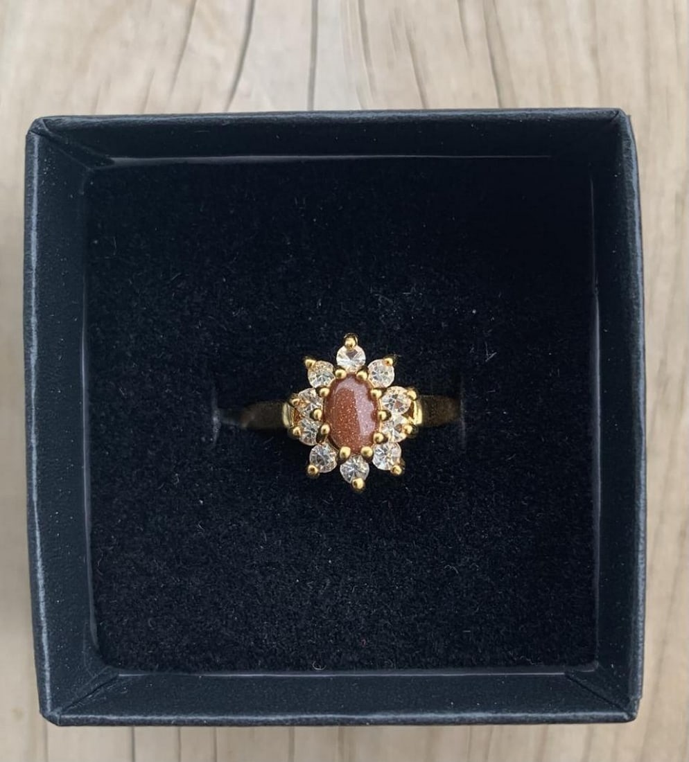 Dolphin Ore Marquise Carnelian Ring: Dolphin Ore Marquise Carnelian Ring This enchanting ring features a 1ct marquise-cut carnelian set in a lustrous 18K gold plated band, designed in the signature Dolphin Ore style. The warm, reddish-or