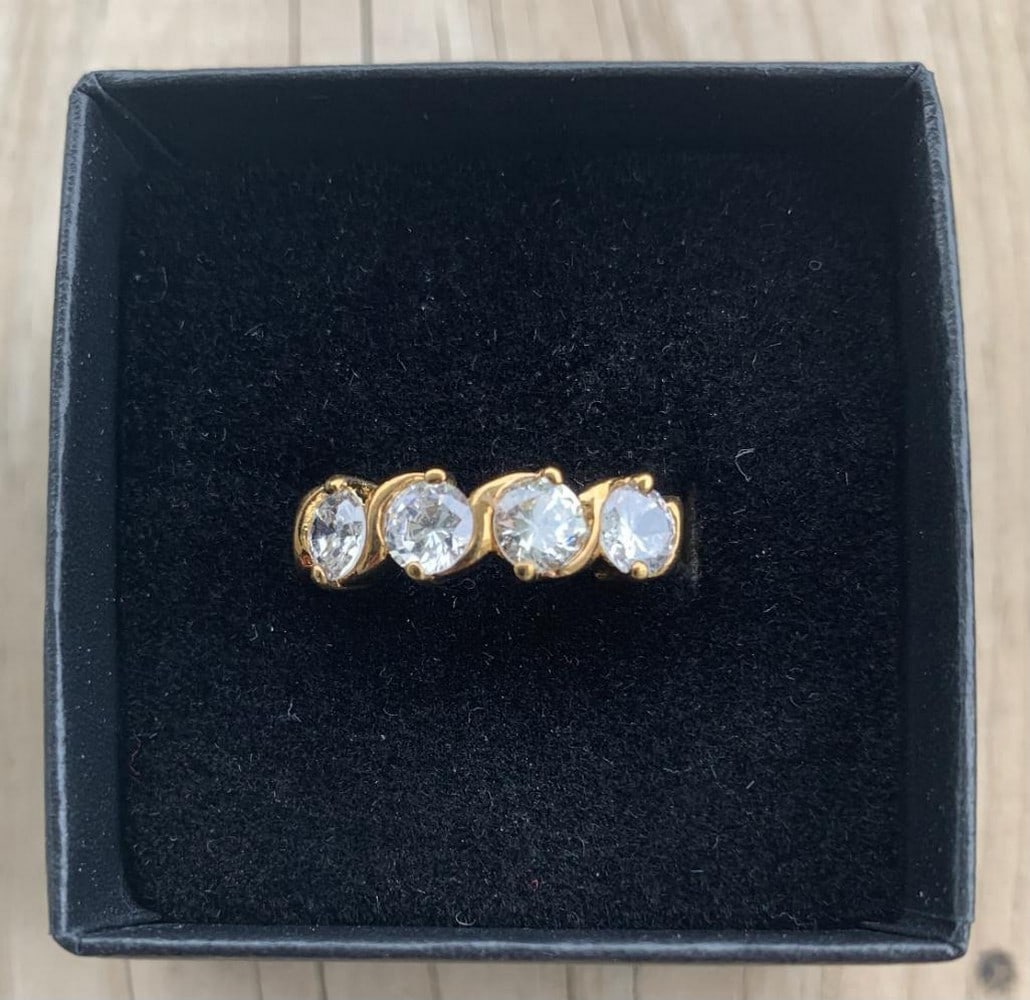 Four-Stone Swarovski CZ ring: Four-Stone Swarovski CZ ring This radiant ring showcases four brilliant Swarvoski cubic zirconia diamonds for added sparkle and sophistication. The band is 18kt gold electroplated. The combination of