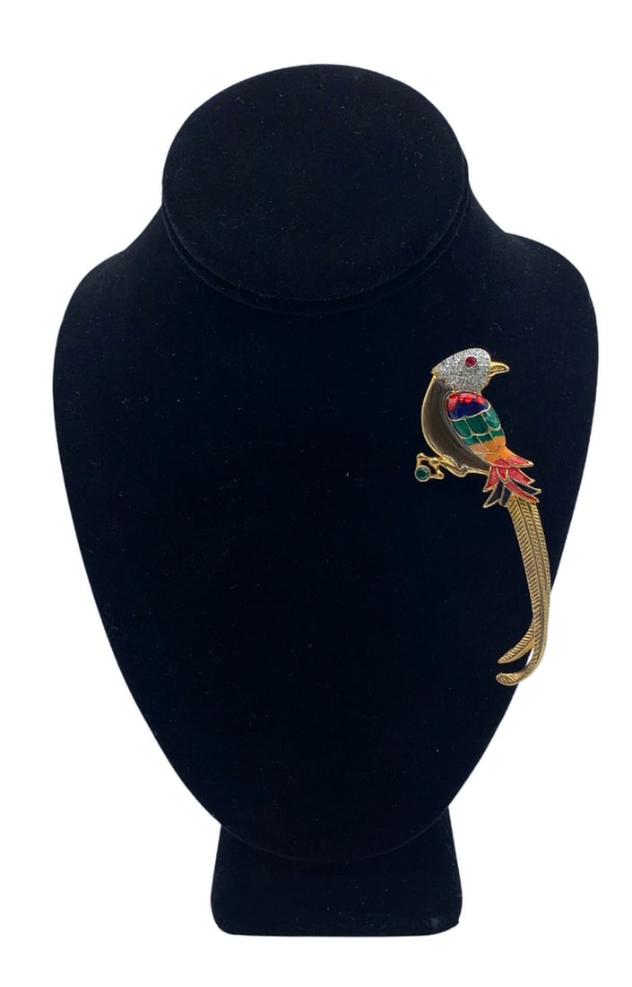 COLOURFUL GEMSTONE PARROT BROOCH: Colourful Gemstone Parrot Brooch Parrots are seen as messengers between the physical and spiritual worlds. They can also represent transformation and change, as they are able to fly high above the gro