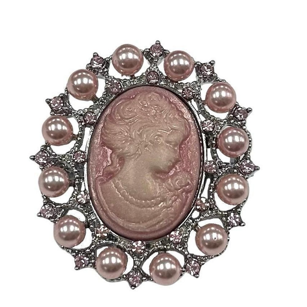 Pink Pearl and Rhinestone Cameo Brooch: Pink Pearl and Rhinestone Cameo Brooch At the heart of this brooch lies the beautifully etched silhouette, a timeless symbol of poise and allure. The intricate detailing of the figure adds an element