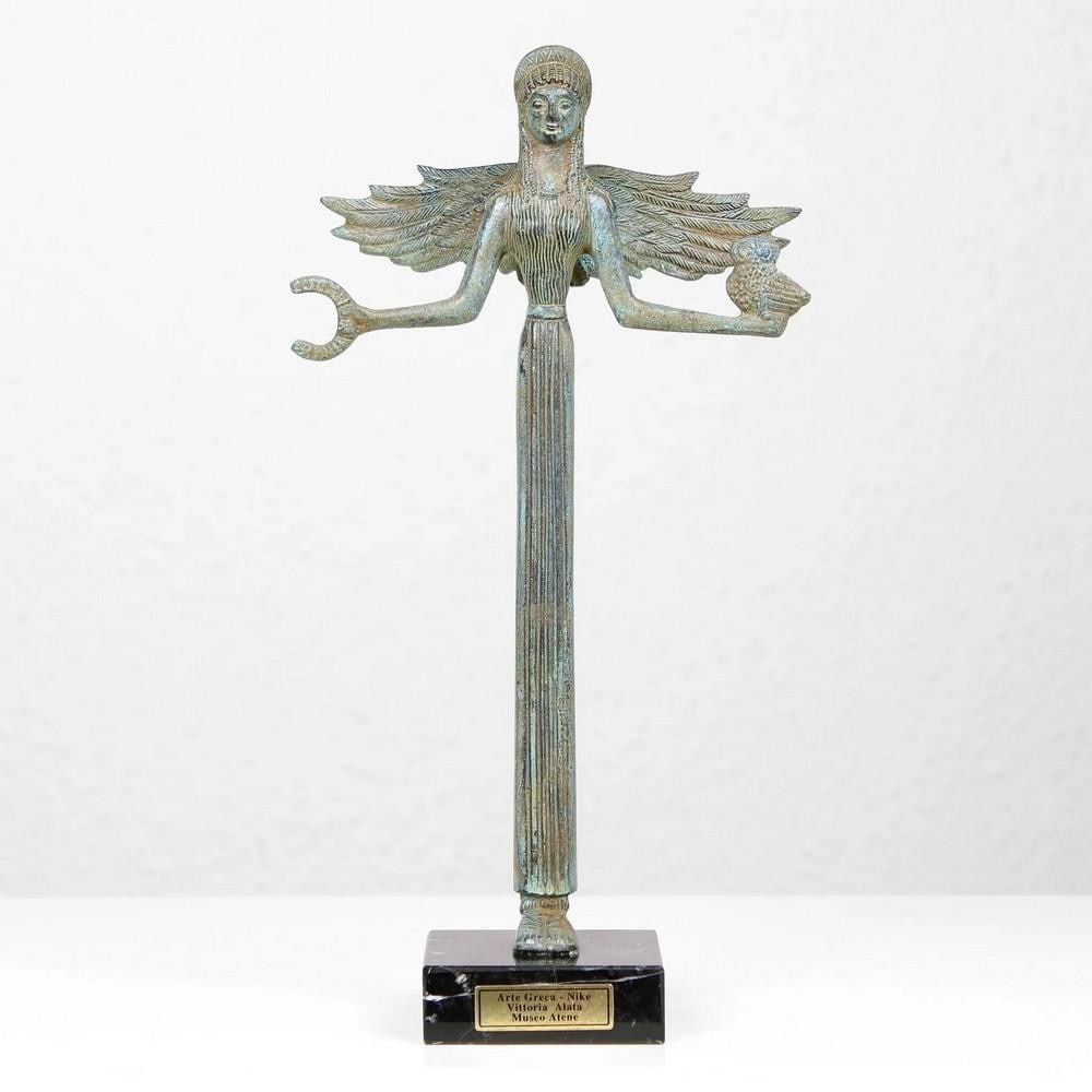 Bronze Statue of Nike Greek Goddess 11.5" x 6.1": Bronze Statue of Nike Greek Goddess 11.5" x 6.1" Nike, the goddess of victory, symbolized success in all fields, including art, music, war, and athletics. In Greek art, she is often depicted a