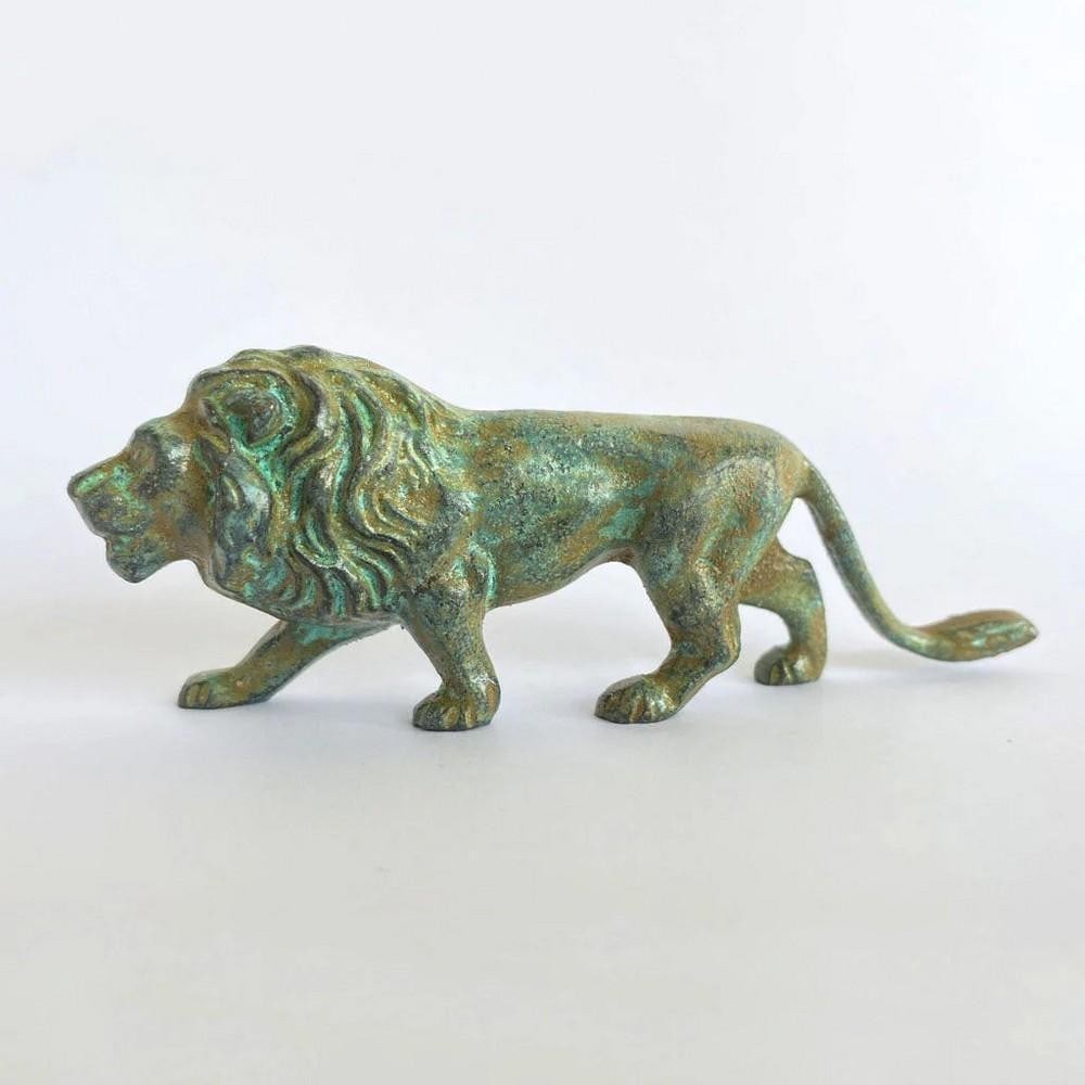 Lion Bronze Statuette in Aged Copper Finish - (0.9lbs): Lion Bronze Statuette in Aged Copper Finish - (0.9lbs) This striking lion statuette features detailed carved patterns and a rich green patina that highlights its classic bronze craftsmanship. Crafted