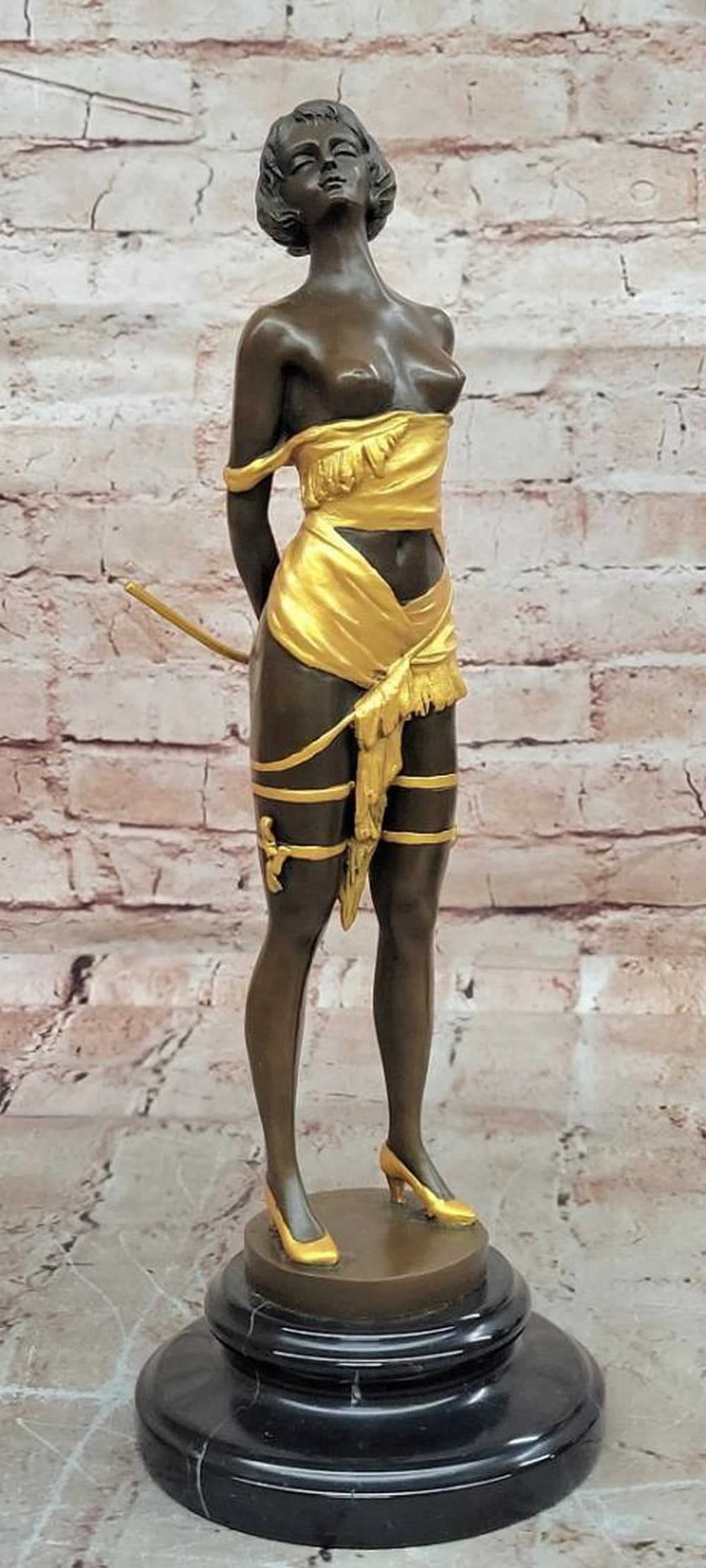 Confident Femme" Bronze Erotic Sculpture by Bruno Zach - 14.5" x 5: "Confident Femme" Bronze Erotic Sculpture by Bruno Zach - 14.5" x 5" This bronze sculpture by Bruno Zach depicts a poised young woman holding a riding crop, embodying elegance, allure,