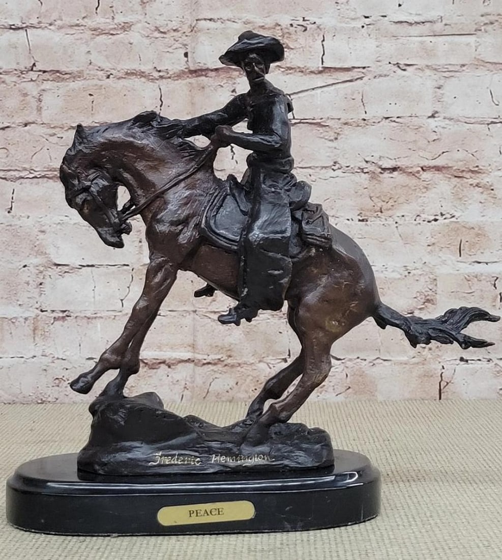 Western Cowboy Peace Bronze Sculpture - 10" x 10": Western Cowboy Peace Bronze Sculpture - 10" x 10" A cowboy charges across the dry land with his gun in the air. His horse gallops, with its nose pointed forward. The cowboy holds the reins tig