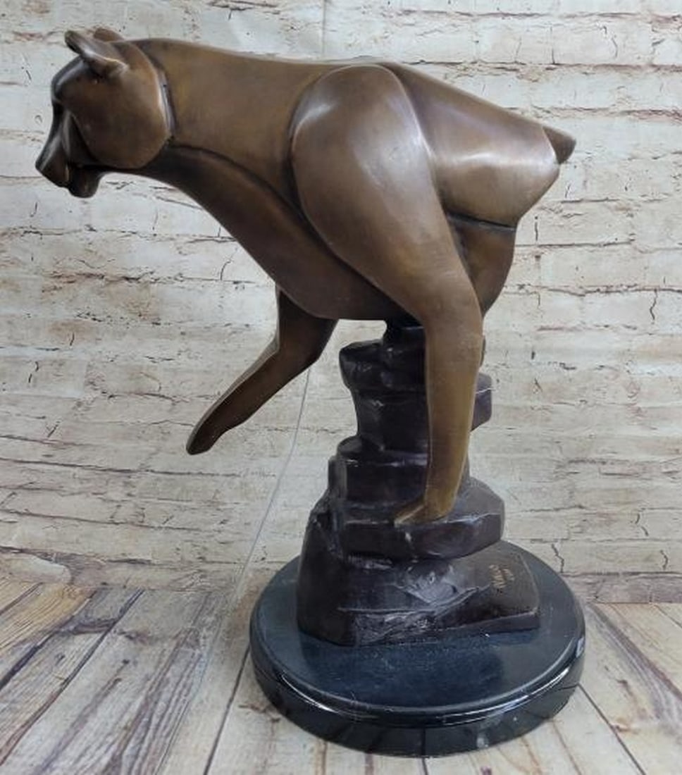 Abstract Half Lioness in Bronze: Abstract Half Lioness in Bronze A striking fusion of strength and elegance, Eclipsed Grace is an abstract bronze sculpture depicting the upper half of a lioness, masterfully rendered in smooth, geomet