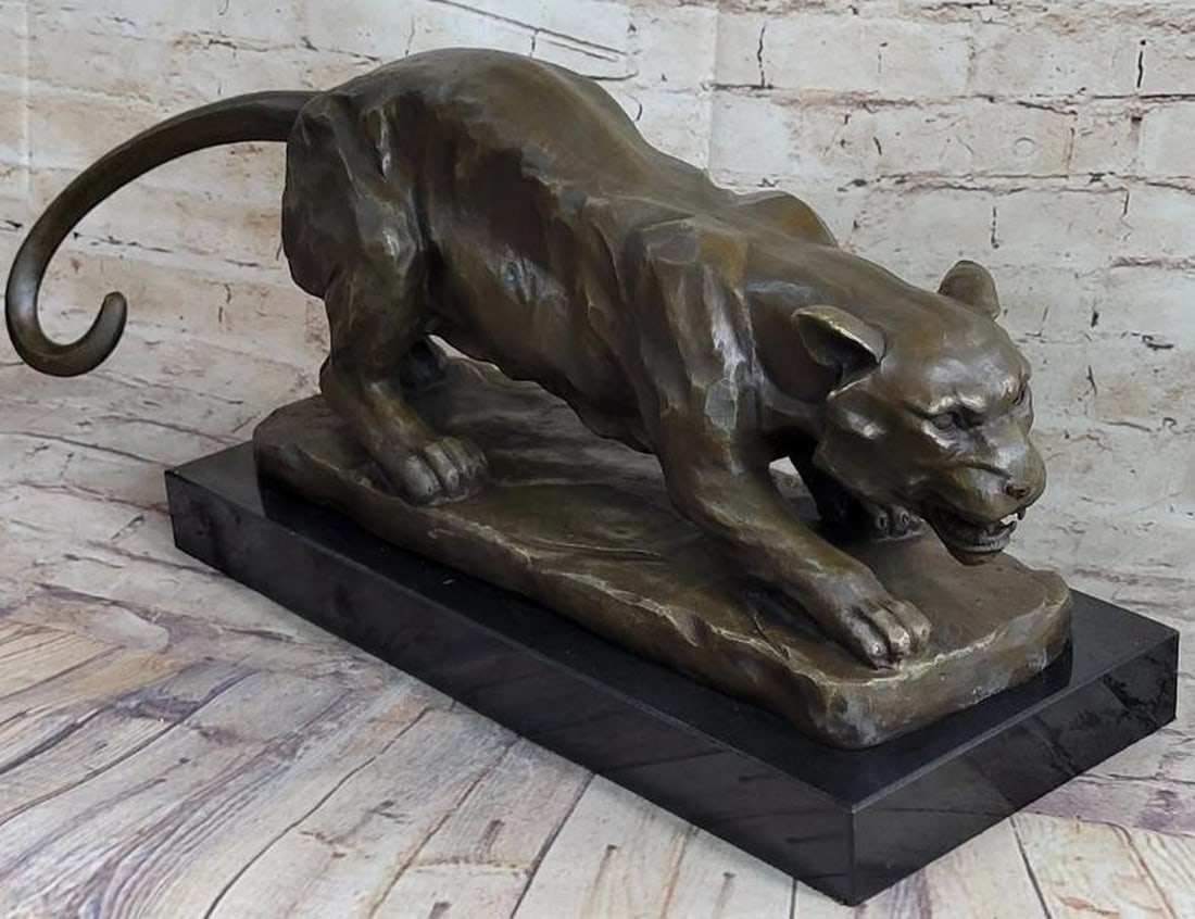 Predator's Poise: Crouching Tiger Bronze Sculpture: Predator's Poise: Crouching Tiger Bronze Sculpture Tense with energy and precision, this is a powerful reproduction bronze sculpture of a crouching tiger, captured at the exact moment before it strike