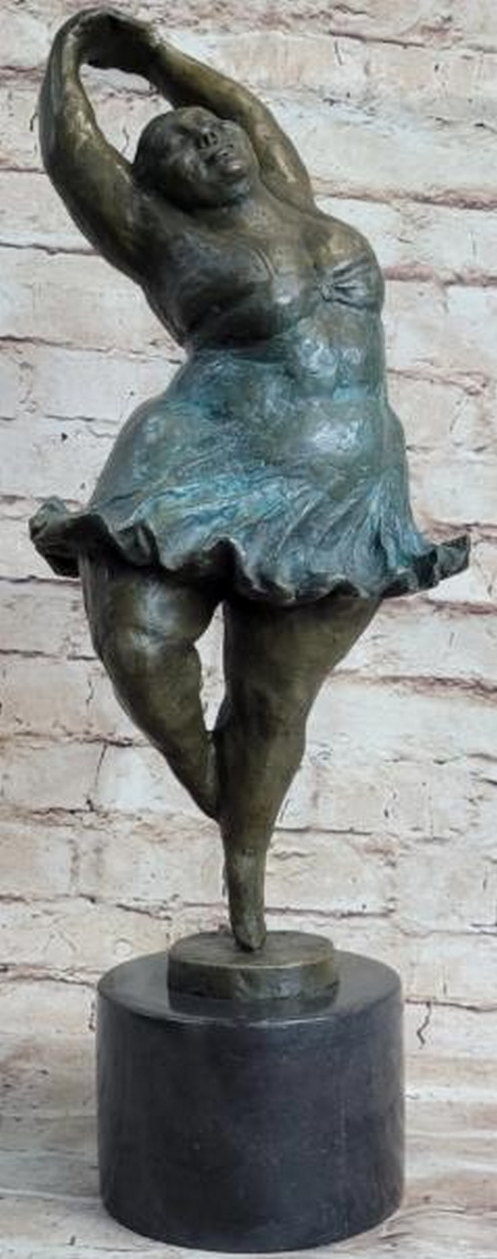 Voluminous Grace Ballerina Bronze Sculpture: Voluminous Grace Ballerina Bronze Sculpture Radiating charm and confidence, this is a captivating bronze sculpture of a ballerina, inspired by the signature style of Fernando Botero and bearing his si
