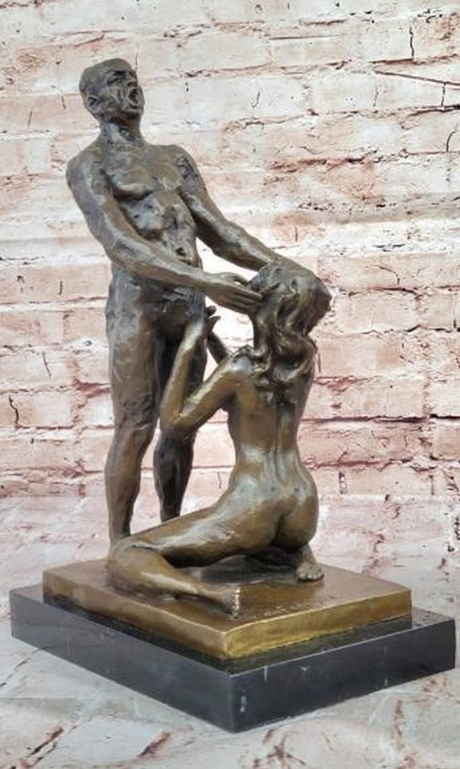 Bronze Sculpture of Love, Strength, and Vulnerability: Bronze Sculpture of Love, Strength, and Vulnerability This striking bronze sculpture bearing the signature of artist Olef Odegaard captures the profound intimacy between a standing male figure and a k