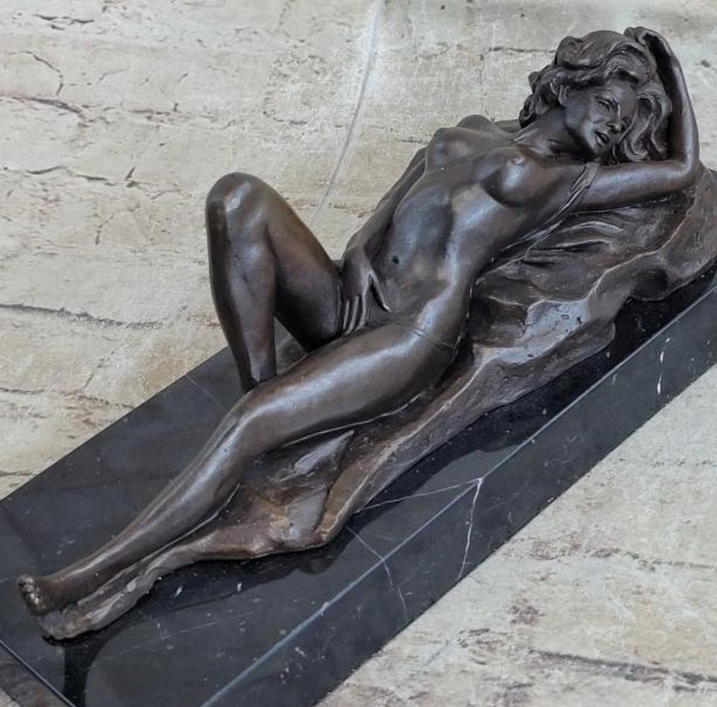 Reverie in Bronze: Nude Woman Reclining Sculpture: Reverie in Bronze: Nude Woman Reclining Sculpture Sensual and serene, this sculpture captures a moment of intimate stillness and self-connection. This evocative sculpture, bearing the signature of art