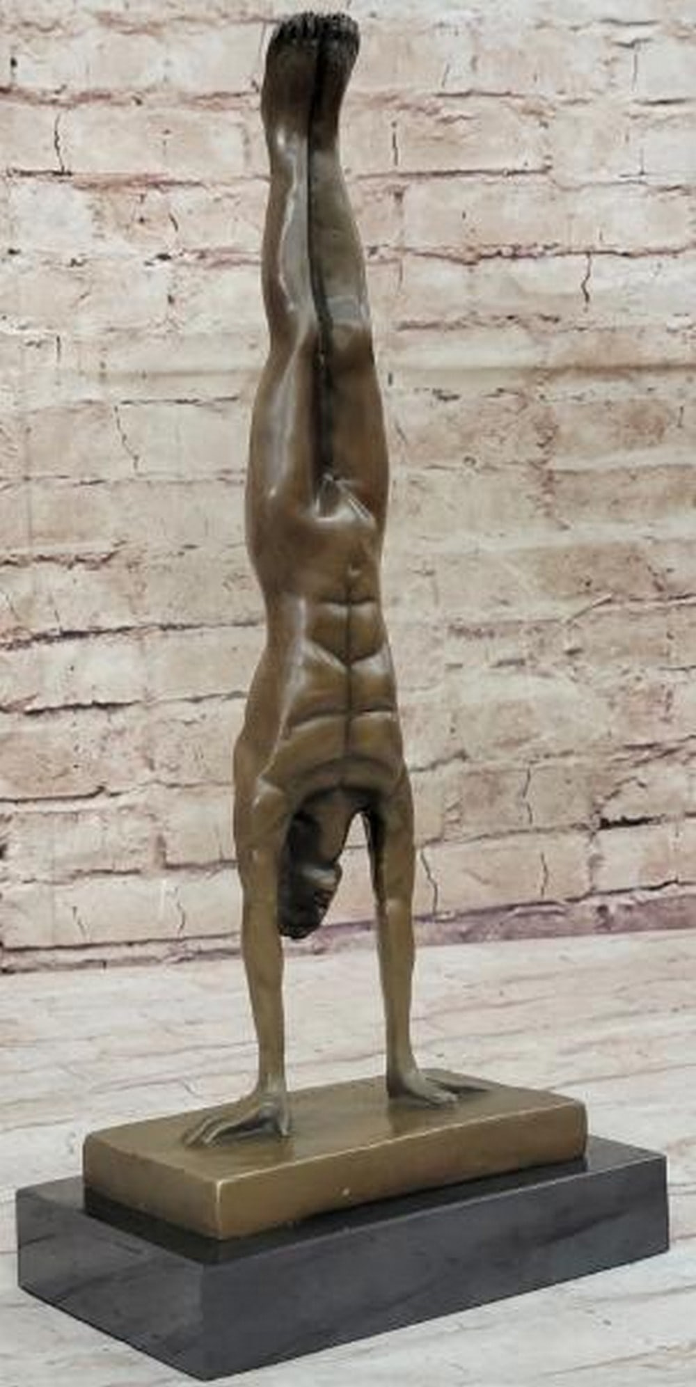 Balance of Power: Nude Male Handstand Bronze Sculpture: Balance of Power: Nude Male Handstand Bronze Sculpture A striking tribute to human strength and control, this sculpture captures a nude, muscular male figure frozen in an elegant handstand. Cast in br