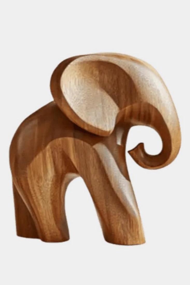 Trunk Grace - Minimalist Wooden Elephant Sculpture: Trunk Grace - Minimalist Wooden Elephant Sculpture A beautifully carved wooden sculpture that captures the gentle strength and wisdom of the elephant through minimalist design. With smooth curves, a