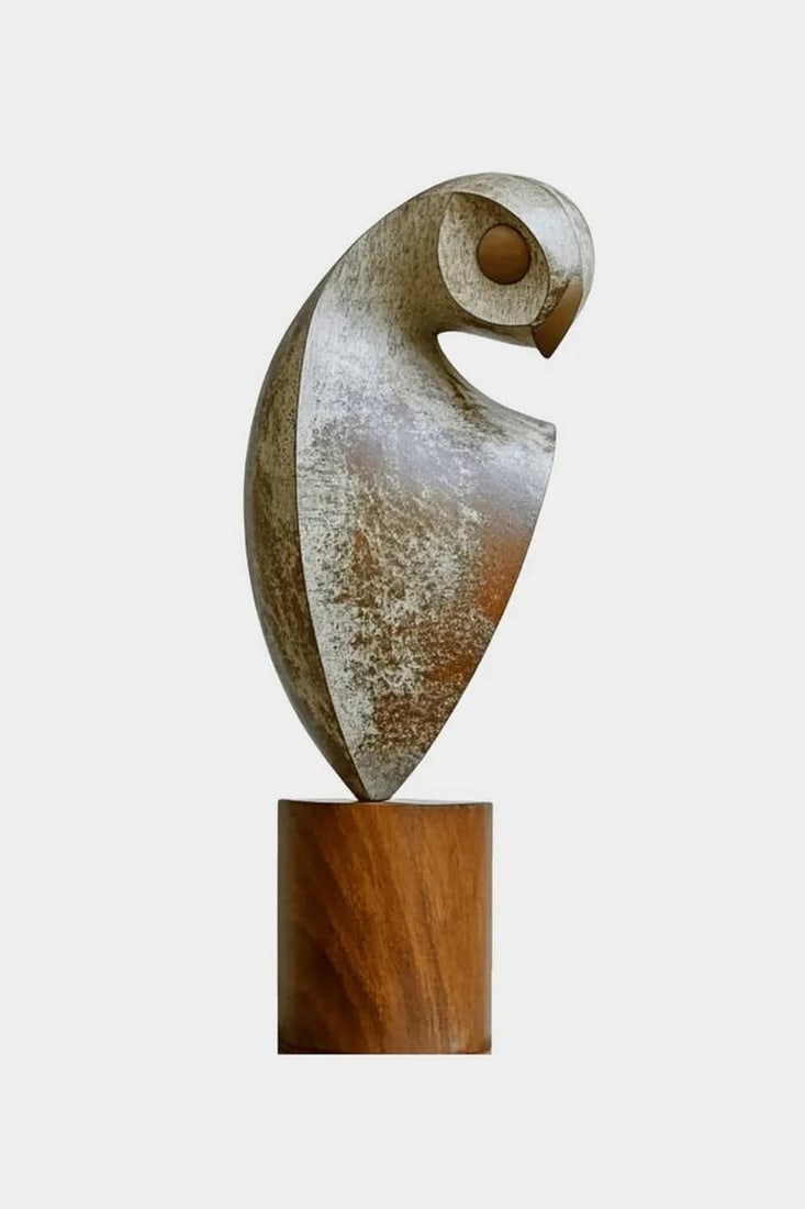 Whispers of the Forest - Abstract Owl in Wood: Whispers of the Forest - Abstract Owl in Wood This elegant wooden sculpture reimagines the owl through minimalistic abstraction. Carved from a single block of natural wood, the stylized figure flows