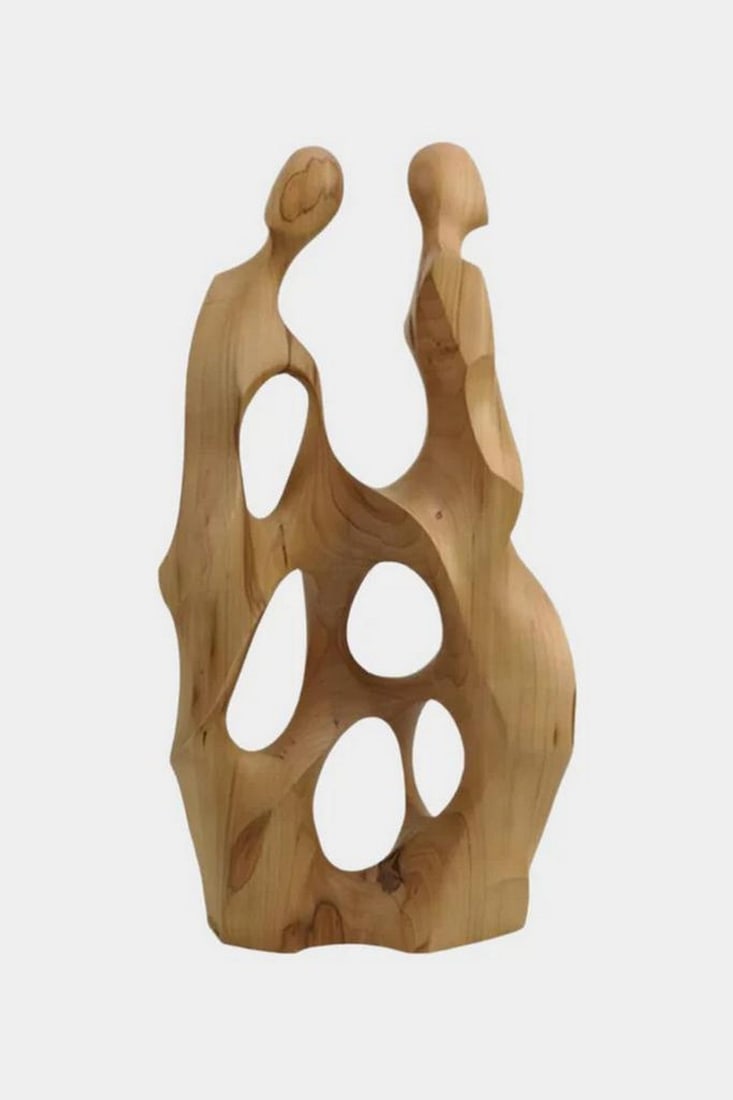 Embrace of Echoes' Wooden Abstract Sculpture: 'Embrace of Echoes' Wooden Abstract Sculpture A striking abstract wooden sculpture depicting two elongated figures entwined in silent dialogue. Crafted with a smooth natural wood finish, the piece fea