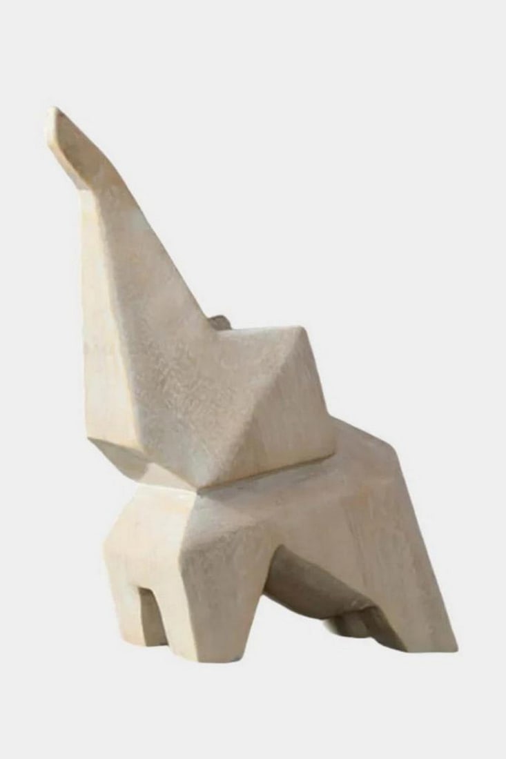 Geometry of Grace' Abstract Elephant Sculpture: 'Geometry of Grace' Abstract Elephant Sculpture A striking sculpture that reimagines the elephant through geometric abstraction and minimalist design. With sharp angles, flat surfaces, and a raised tr