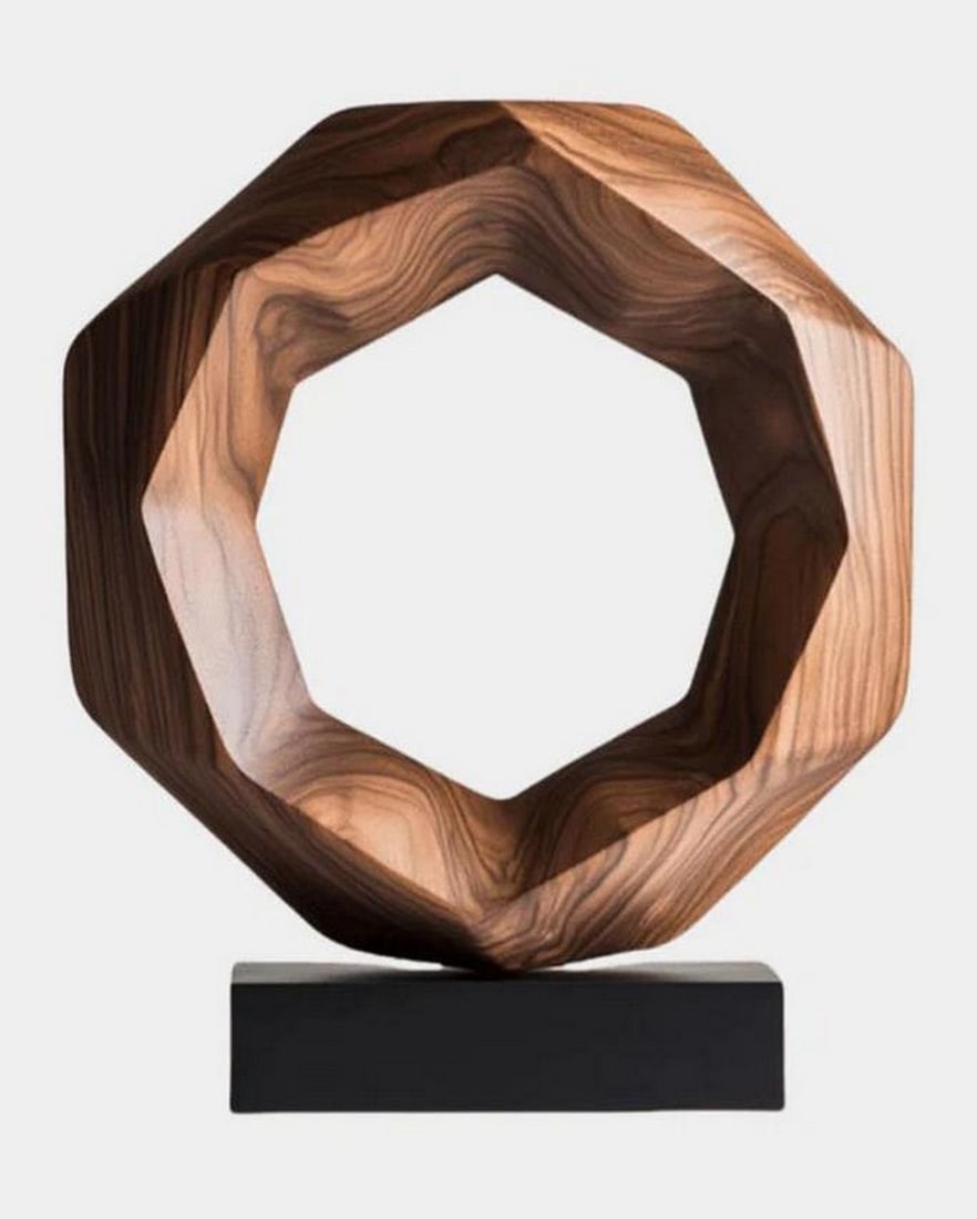 Contemporary Octagonal Wooden Sculpture: Contemporary Octagonal Wooden Sculpture A modern octagonal wood sculpture with rich natural tones and geometric precision. Its warm grain and clean lines are beautifully showcased on a minimalist blac