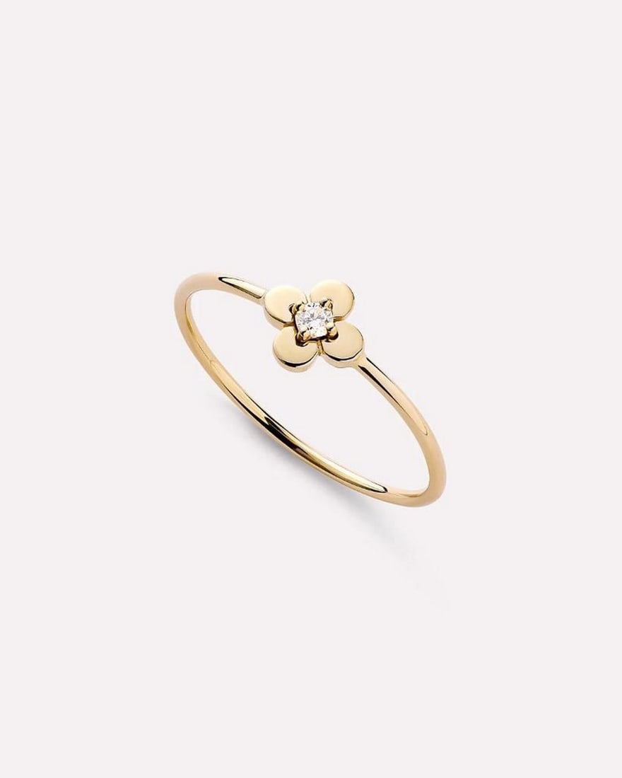 Solid Gold Flower Ring: Solid Gold Flower Ring This ring is crafted from recycled solid yellow gold with a slim band and a flower detail set with a lab-grown diamond. Its durable design is resistant to water and tarnish,