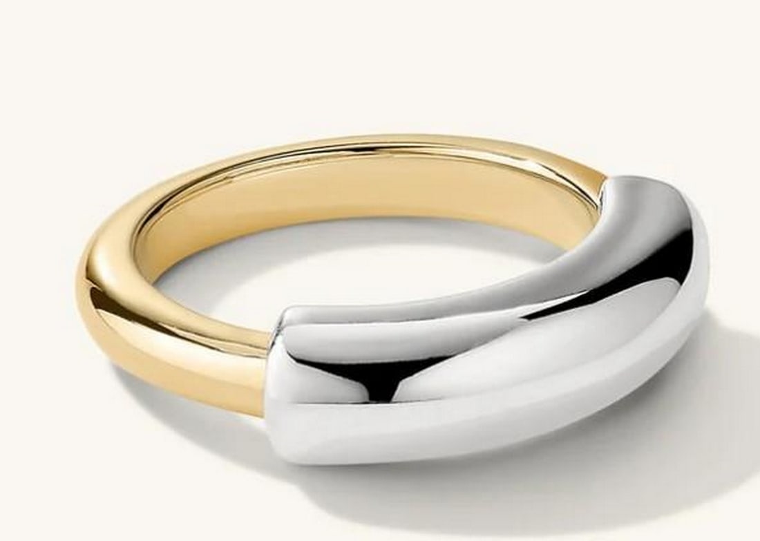 Contemporary Mixed Tube Ring: Contemporary Mixed Tube Ring This striking mixed tube ring combines sleek tubular shapes in varying textures or metals to create a bold, modern statement. Its layered design offers depth and dimension