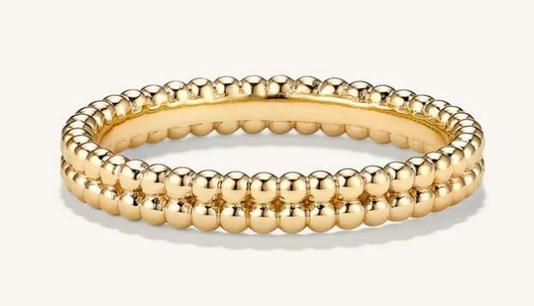 Twin Bead Stacker Ring: Twin Bead Stacker Ring Delicate and refined, the Twin Bead Stacker Ring features many polished metal beads anchored on a slender open band. Designed for versatility, it can be worn solo for a