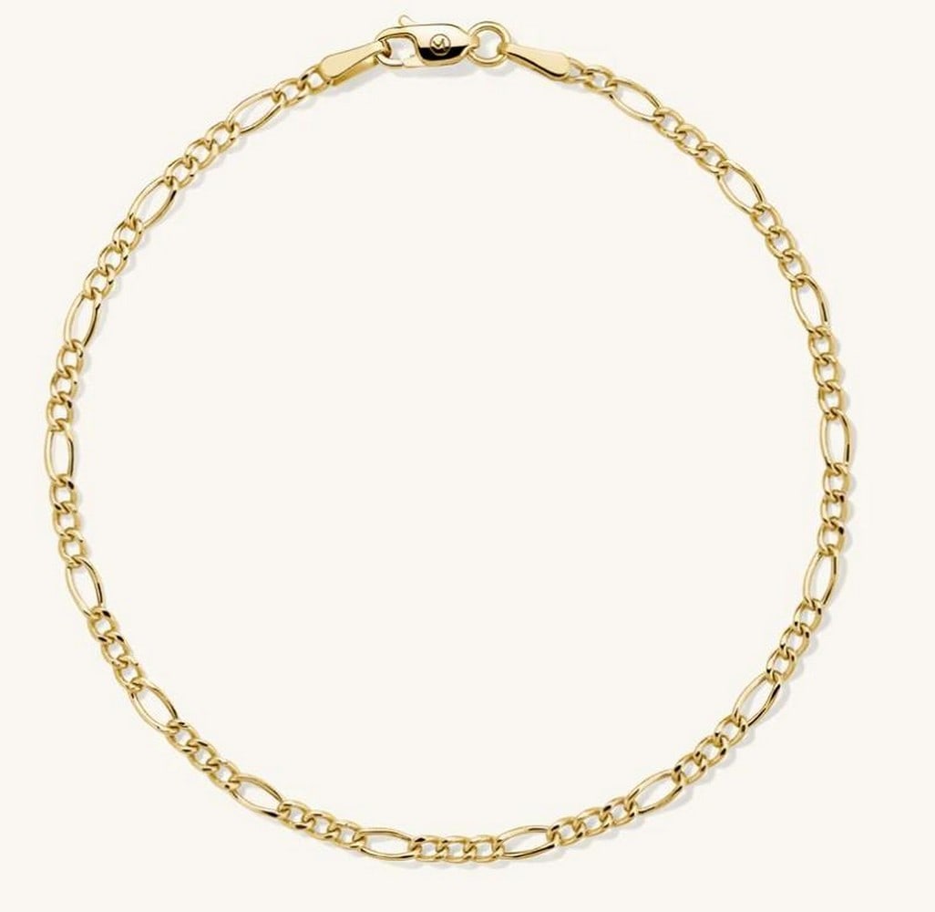 Classic Figaro Link Chain Bracelet: Classic Figaro Link Chain Bracelet Classic and effortlessly stylish, this Figaro chain bracelet features a timeless pattern of alternating short and elongated links. Crafted in polished metal with a