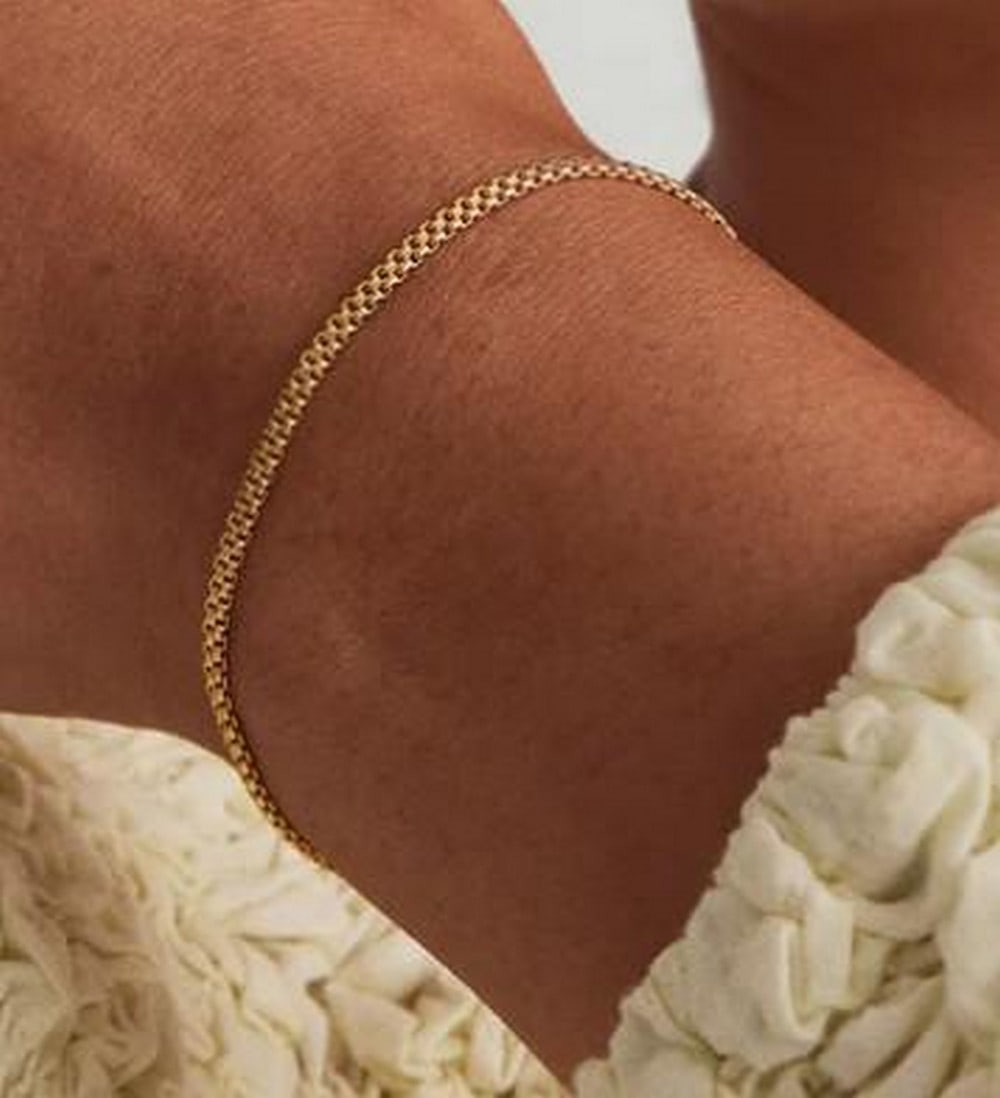 Bold Polished Spheres Bracelet: Bold Polished Spheres Bracelet Statement-making and sculptural, this bracelet features a strand of high-shine metal spheres in a bold, uniform silhouette. Its smooth, reflective surface adds instant i