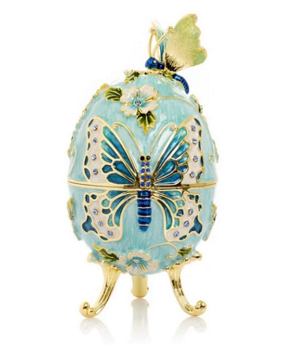 The Enchanted Bloom Egg Trinket Box: The Enchanted Bloom Egg Trinket Box This exquisite enamel-painted trinket box is a handcrafted masterpiece, adorned with handpicked Austrian crystals and finished in your choice of 24K gold or 925 sil