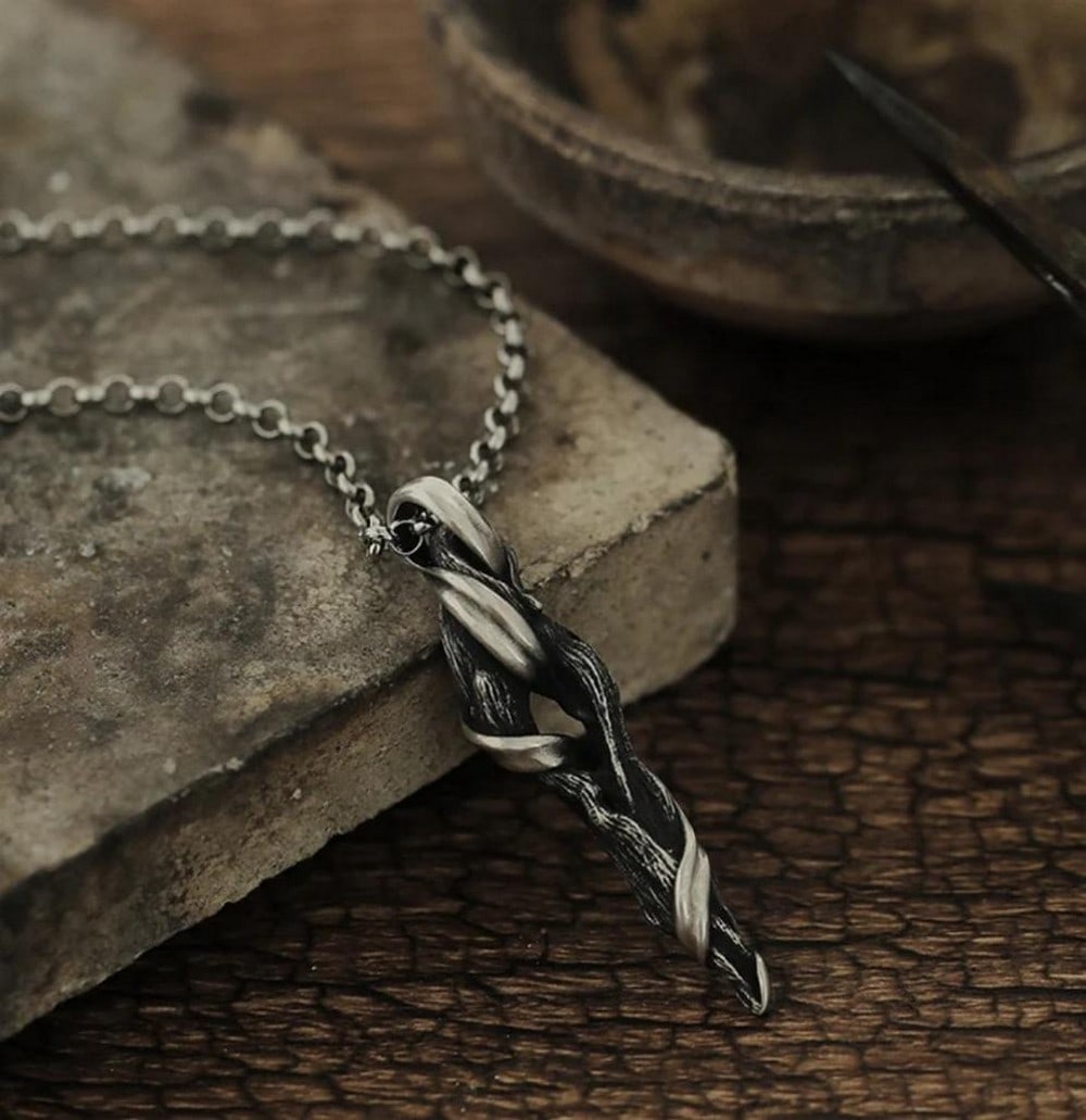 Driftwood Necklace: Driftwood Necklace Handcrafted in Mongolia, the Driftwood Necklace captures the organic beauty of nature through traditional artisanal technique. Carved and polished by hand, each piece channels the