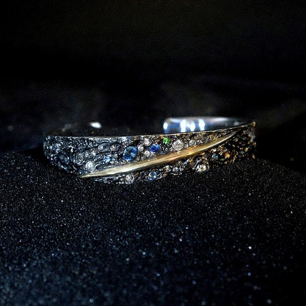 Meteorite and Fire Bangle: Meteorite and Fire Bangle Forged with fragments of real meteorite, the Meteorite and Fire Bangle bridges the cosmos and Mongolian tradition. Expertly handcrafted, it combines the raw, textured energy