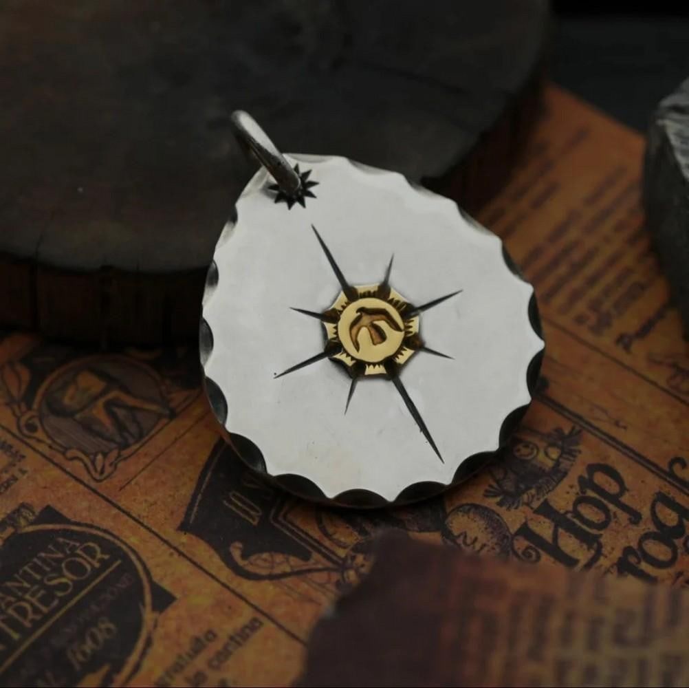 Octagram Eagle Pendant: Octagram Eagle Pendant Handcrafted by Mongolian artisans, the Octagram Eagle Pendant captures the soaring power and freedom of Mongolia's revered eagle. Featuring a double-sided design and finished