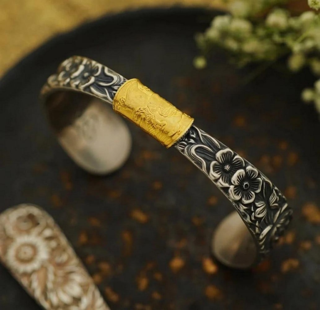 Mongolian Silver Spoon Flower Bangle: Mongolian Silver Spoon Flower Bangle Once a humble silver spoon, now a work of wearable art - this handcrafted bangle is transformed by Mongolian artisans into a graceful floral design that honors