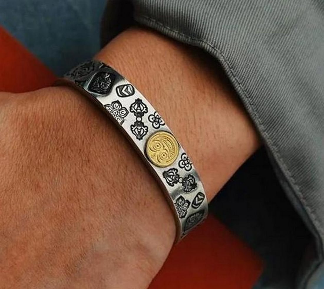 Zakiram Bangle of Prosperity: Zakiram Bangle of Prosperity Handcrafted by Mongolian artisans, the Zakiram Bangle is a symbolic tribute to the god of wealth. Featuring intricate, tradition-inspired patterns, this self-adjusting bra