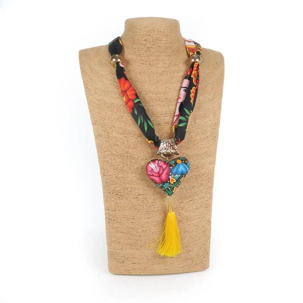 Oaxacan Alebrije Wood Carving Heart & Flowers Necklace: Oaxacan Alebrije Wood Carving Heart & Flowers Necklace Handcrafted heart-shaped necklace carved from locally sourced copal wood and painted with colorful floral designs and traditional Zapotec pattern