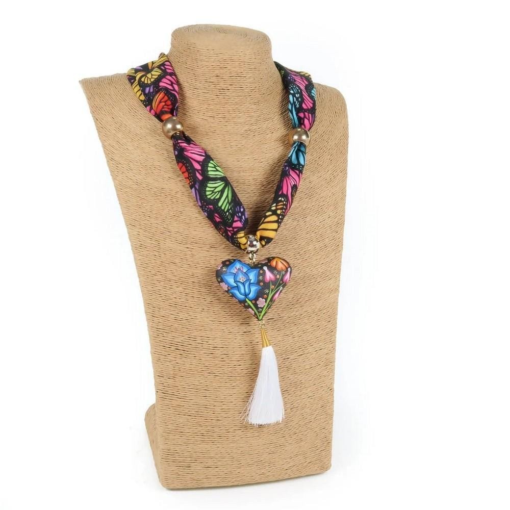 Oaxacan Alebrije Heart & Flowers Necklace - Handcrafted Copal Wood: Oaxacan Alebrije Heart & Flowers Necklace - Handcrafted Copal Wood This vibrant heart-shaped necklace is handcrafted from locally sourced copal wood and painted with colorful floral designs and tradit