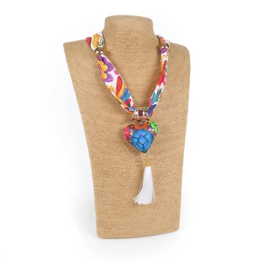 Oaxacan Alebrije Wood Carving Heart & Flowers Necklace: Oaxacan Alebrije Wood Carving Heart & Flowers Necklace Beautiful heart necklace handcrafted from locally sourced copal wood and painted with vibrant floral designs and traditional Zapotec patterns.