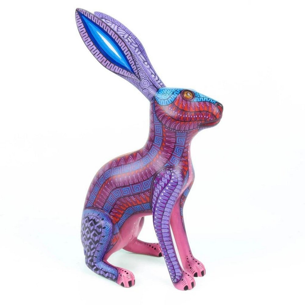 Purple Guardian Rabbit - Fine Copal Wood Alebrije by Morales Artists: Purple Guardian Rabbit - Fine Copal Wood Alebrije by Morales Artists Discover the beauty and spirit of traditional Oaxacan craftsmanship with this Purple Guardian Rabbit alebrije, carved and painted b