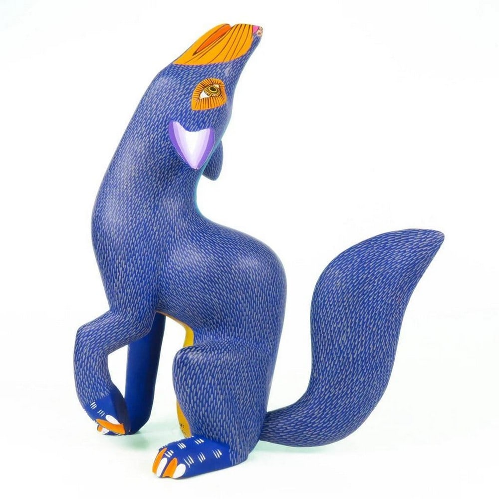 Vibrant Howling Coyote - Oaxacan Wood Alebrije: Vibrant Howling Coyote - Oaxacan Wood Alebrije Bring the spirit of Oaxaca into your collection with this Vibrant Howling Coyote alebrije, handcrafted by the renowned Morales family in Arrazola. Carved