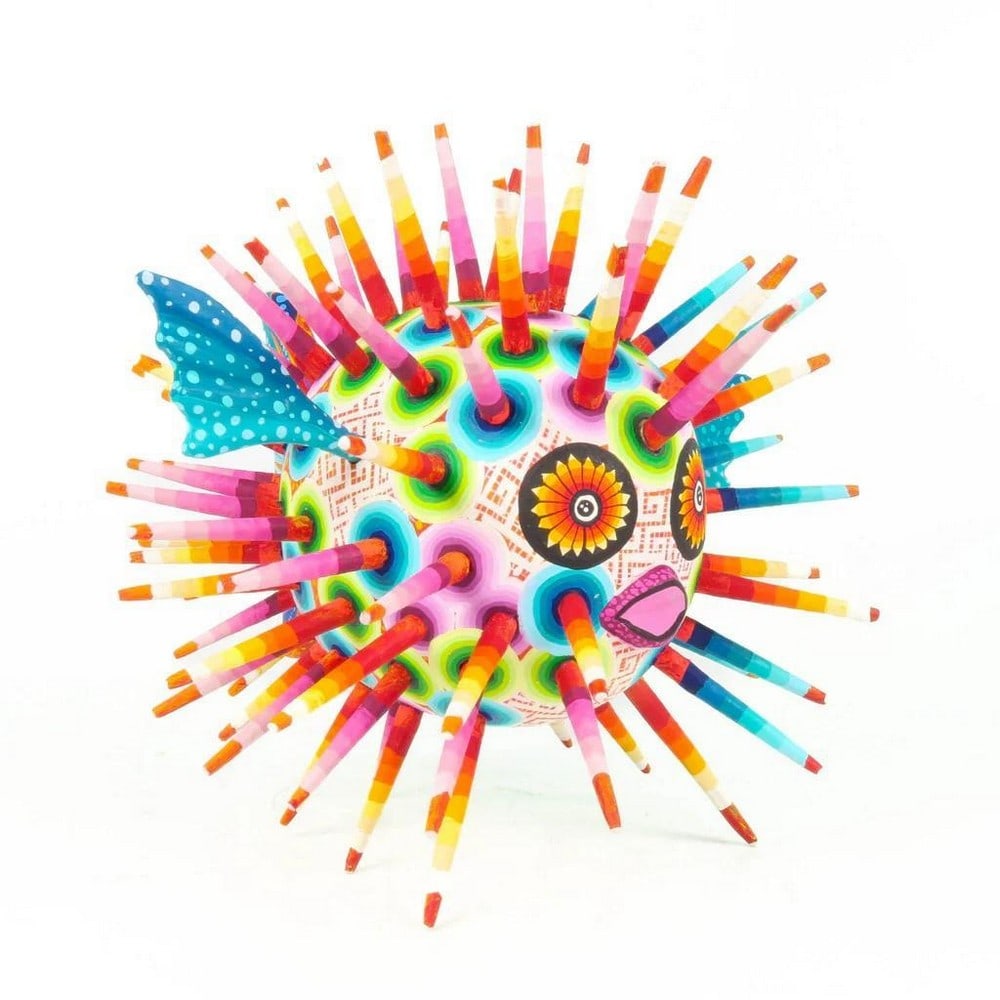 Colorful Blowfish - Oaxacan Wood Alebrije: Colorful Blowfish - Oaxacan Wood Alebrije Experience the exceptional craftsmanship of Oaxaca with this Colorful Blowfish alebrije, expertly carved from a single piece of copal wood and hand-painted in