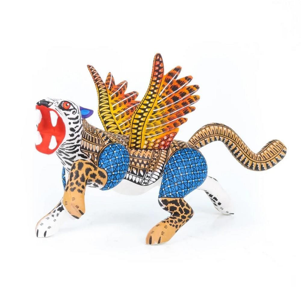 Soaring Winged Jaguar - Exquisite Oaxacan Alebrije by the Ramirez Family: Soaring Winged Jaguar - Exquisite Oaxacan Alebrije by the Ramirez Family Unleash the spirit of Oaxaca with this Soaring Winged Jaguar alebrije, meticulously handcrafted by the acclaimed Ramirez family