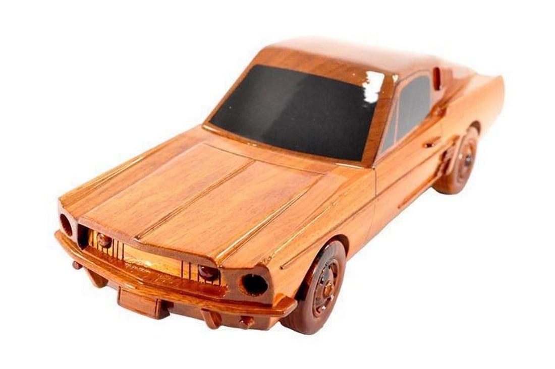 1968 Mustang GT Fastback Wooden Model: 1968 Mustang GT Fastback Wooden Model The classic Mustang GT Fastback is wonderfully replicated in this solid mahogany scale model. Movable wheels, finely detailed molding and front grill along with