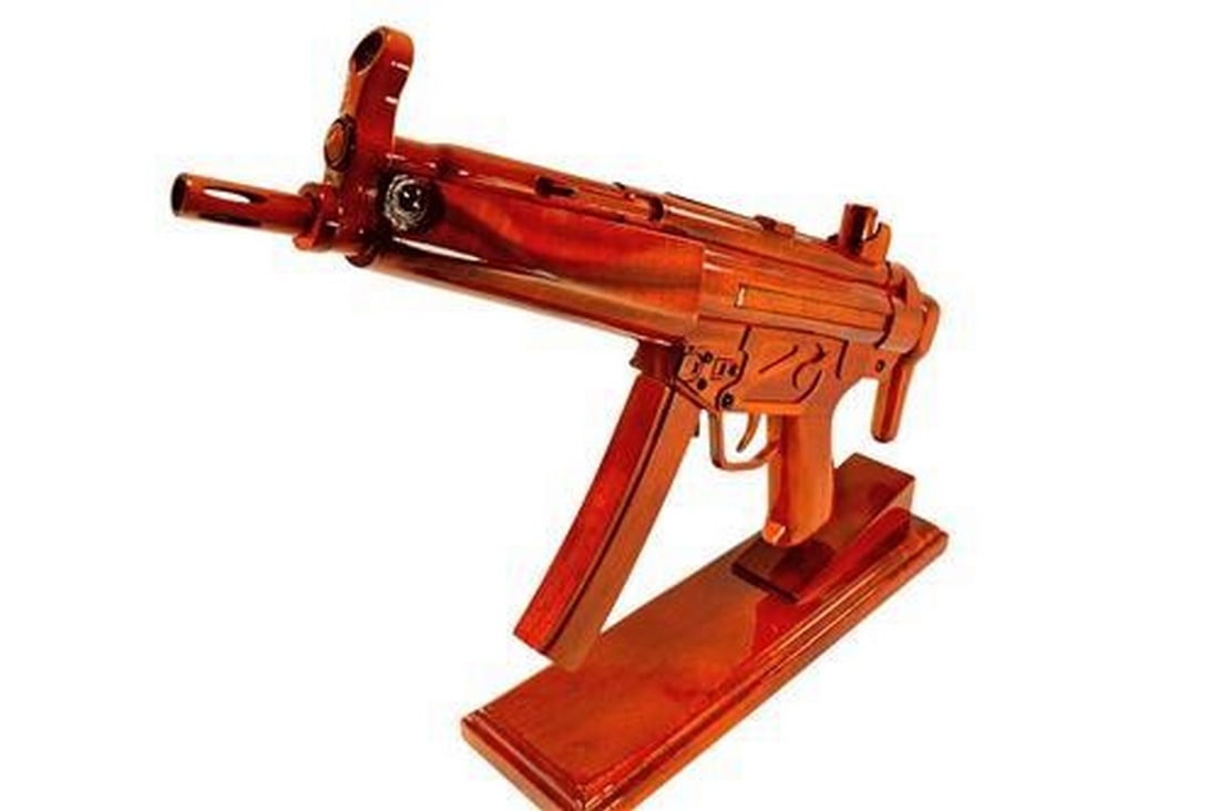 Wooden MP-5 Gun Replica: Wooden MP-5 Gun Replica If you're looking for that very special gift or award, then this is it. Handcrafted from solid mahogany and given three coats of polyurethane to give it a durable high gloss