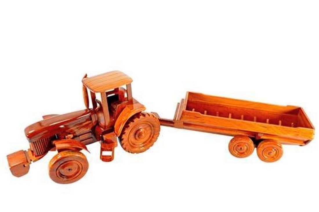 Tractor: Tractor The Tractor is beautifully recreated in this handcrafted scale model. Made of solid mahogany and finely detailed, this model has a clear polyurethane high gloss finish has deep wood grain and 