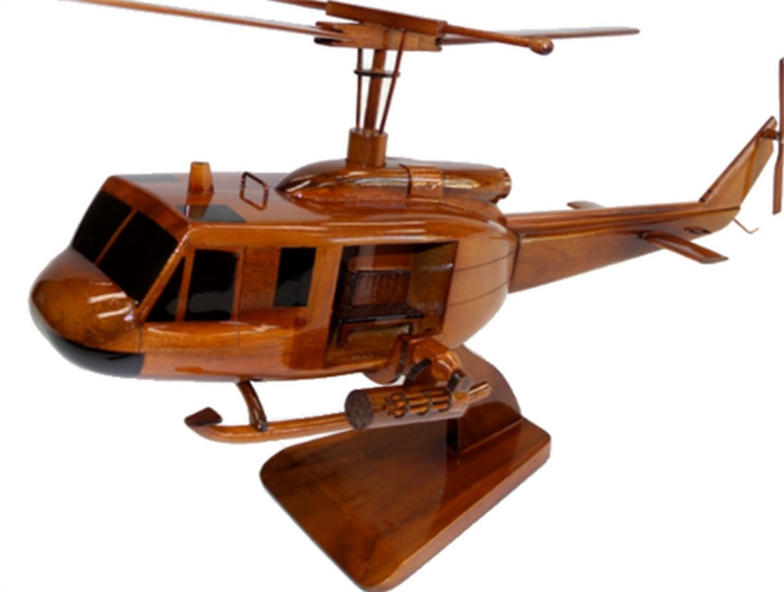 UH-1 Huey Gunship Helicopter: UH-1 Huey Gunship Helicopter The UH-1 Gunship is beautifully recreated in this handcrafted scale model. Made of solid mahogany and finely detailed, this classic aircraft in a clear polyurethane high