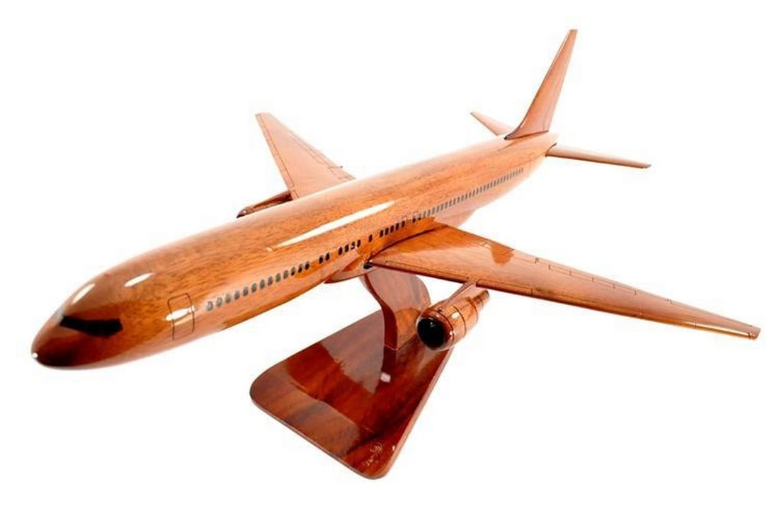 Boeing 767 Wooden Model Plane: Boeing 767 Wooden Model Plane This Boeing 767 scale model is handcrafted from solid mahogany, featuring meticulous detailing and a high-gloss finish that accentuates the natural wood grain. It comes