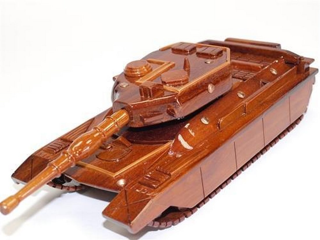 T-95 Medium Tank: T-95 Medium Tank Handcrafted from solid mahogany, this T-95 tank is finely detailed with movable gun turret and track. Three coats of polyurethane finish adds high gloss and rich wood grain depth.