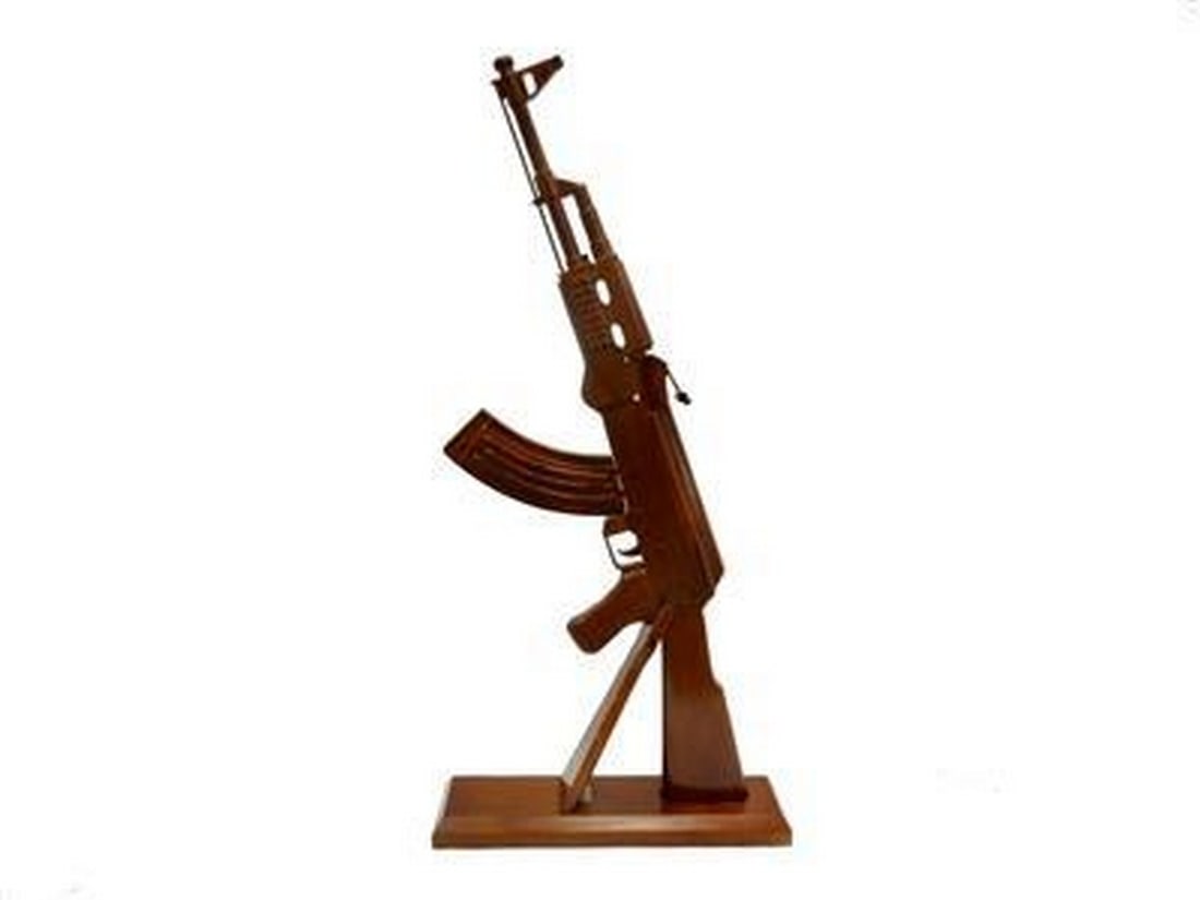 Wooden AK-47 Gun Replica: Wooden AK-47 Gun Replica If you're looking for that very special gift or award, then this is it. Handcrafted from solid mahogany and given three coats of polyurethane to give it a durable high gloss