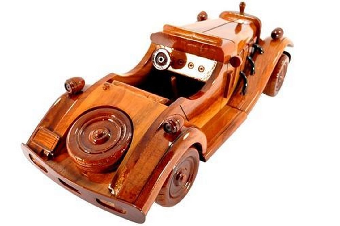 Classic Vintage Car: Classic Vintage Car The classic Vintage Car is wonderfully replicated in this solid mahogany scale model. Movable wheels, finely detailed molding and front grill along with air scoops and seam