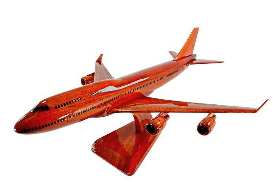 BOEING 747 Wooden Model Replica: BOEING 747 Wooden Model Replica This Boeing 747 scale model is meticulously handcrafted from solid mahogany. The careful detailing and high gloss finish showcase the beautiful wood grain. A stand is