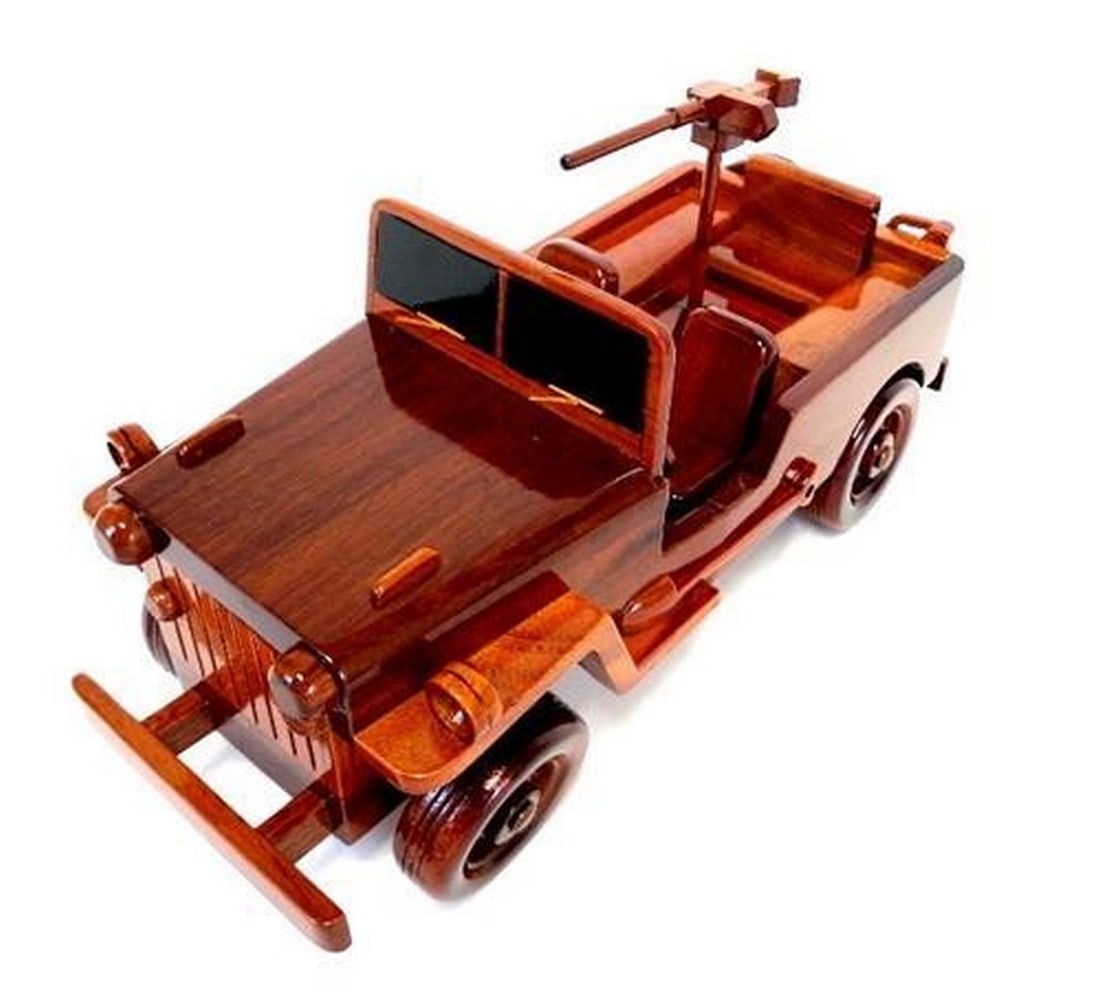 Willy's Military Jeep Wooden Model: Willy's Military Jeep Wooden Model The Willy's Military Jeep is beautifully recreated in this handcrafted scale model. Made of solid mahogany and finely detailed, this classic aircraft in a clear